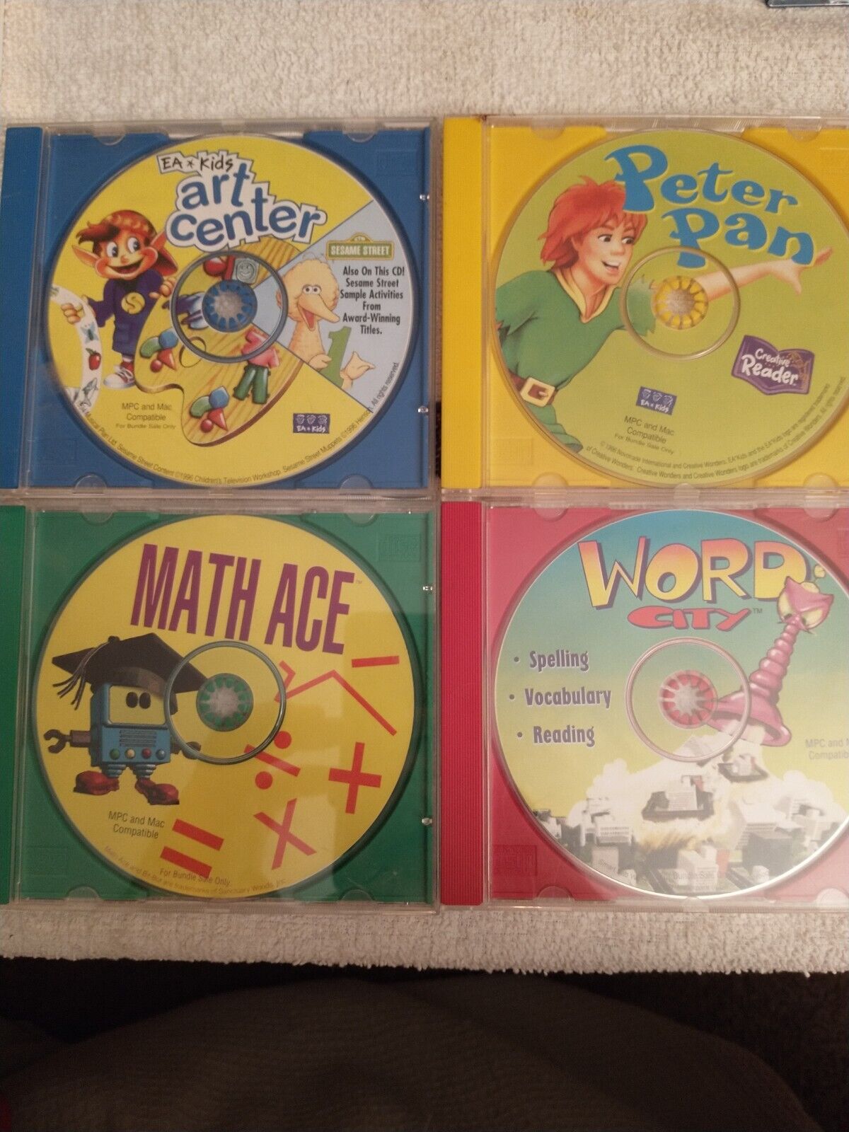 Lot Of 4 Teaching CD Roms. Math Ace, Peter Pan, Sesame Street, Word City