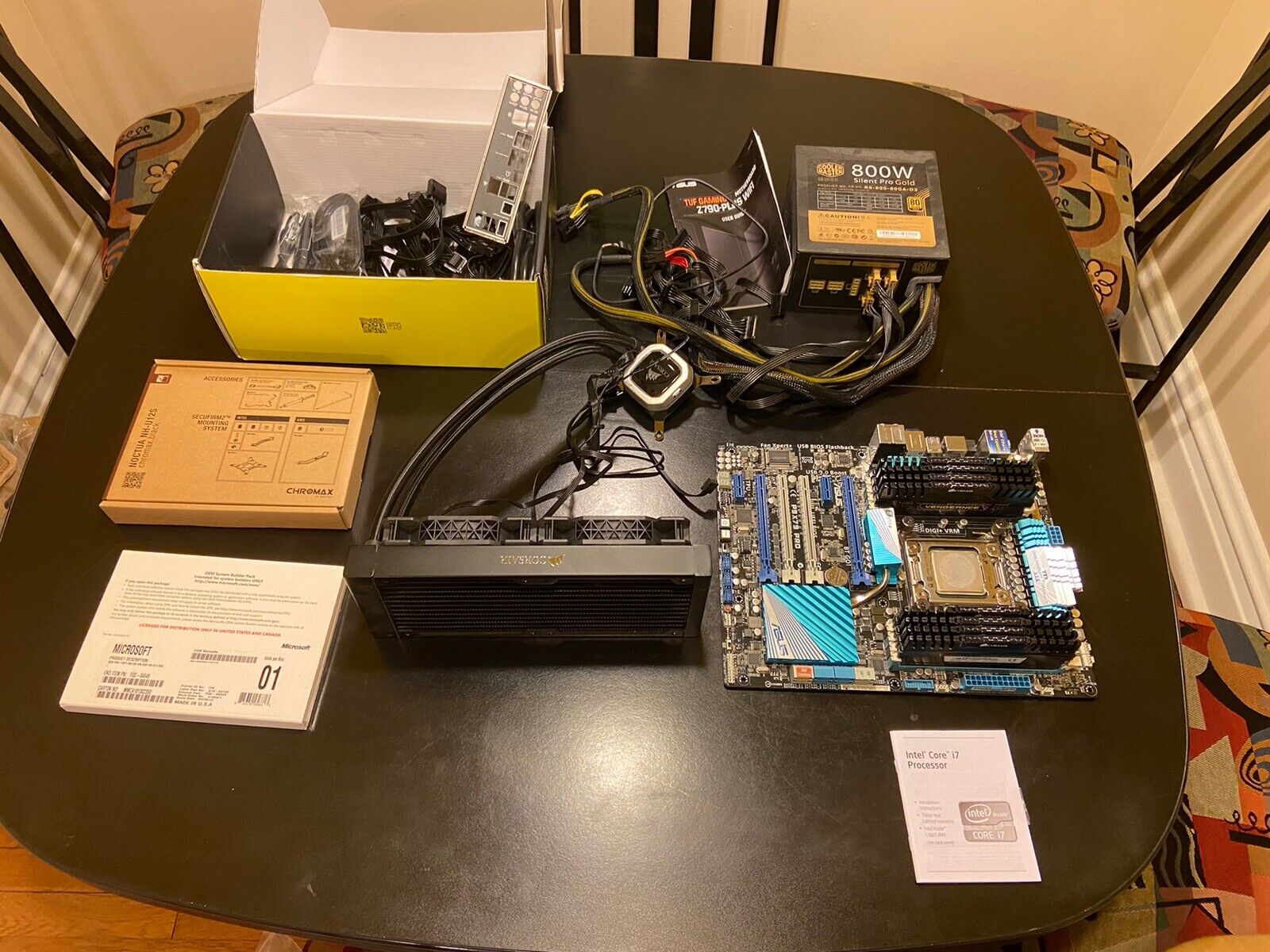 Computer parts lot. Motherboard, Cooling Fan, Power Source, Processor, Extra RAM