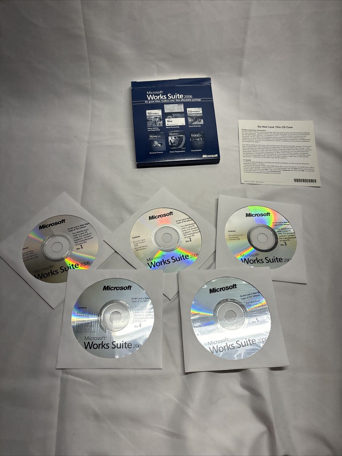 MICROSOFT WORKS SUITE 2006 - 5 CD'S - WITH PRODUCT KEY - OPENED BOX