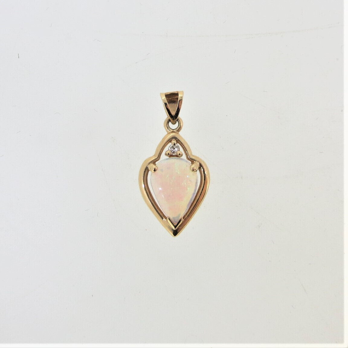 14K Yellow Gold Pear Shaped Opal Diamond Chip Accent Pendant