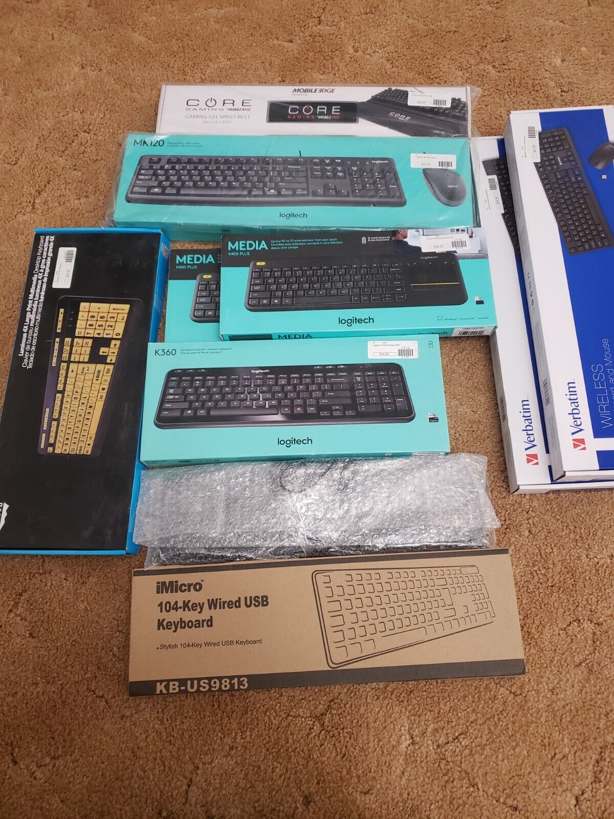 Bundle of 9 Brand new Keyboards (4 of the Logitech) and 1 Gaming Wrist Rest