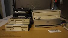Lot of (4) floppy drives and (2) cd rom drives.  picture