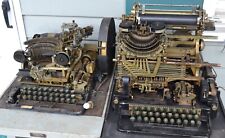 TWO VINTAGE WWII ERA TELETYPE MACHINES WITH ORIGINAL MANUALS & TABLES picture