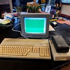 vintage atari 520st home computer system with extra disks and a few games.   picture