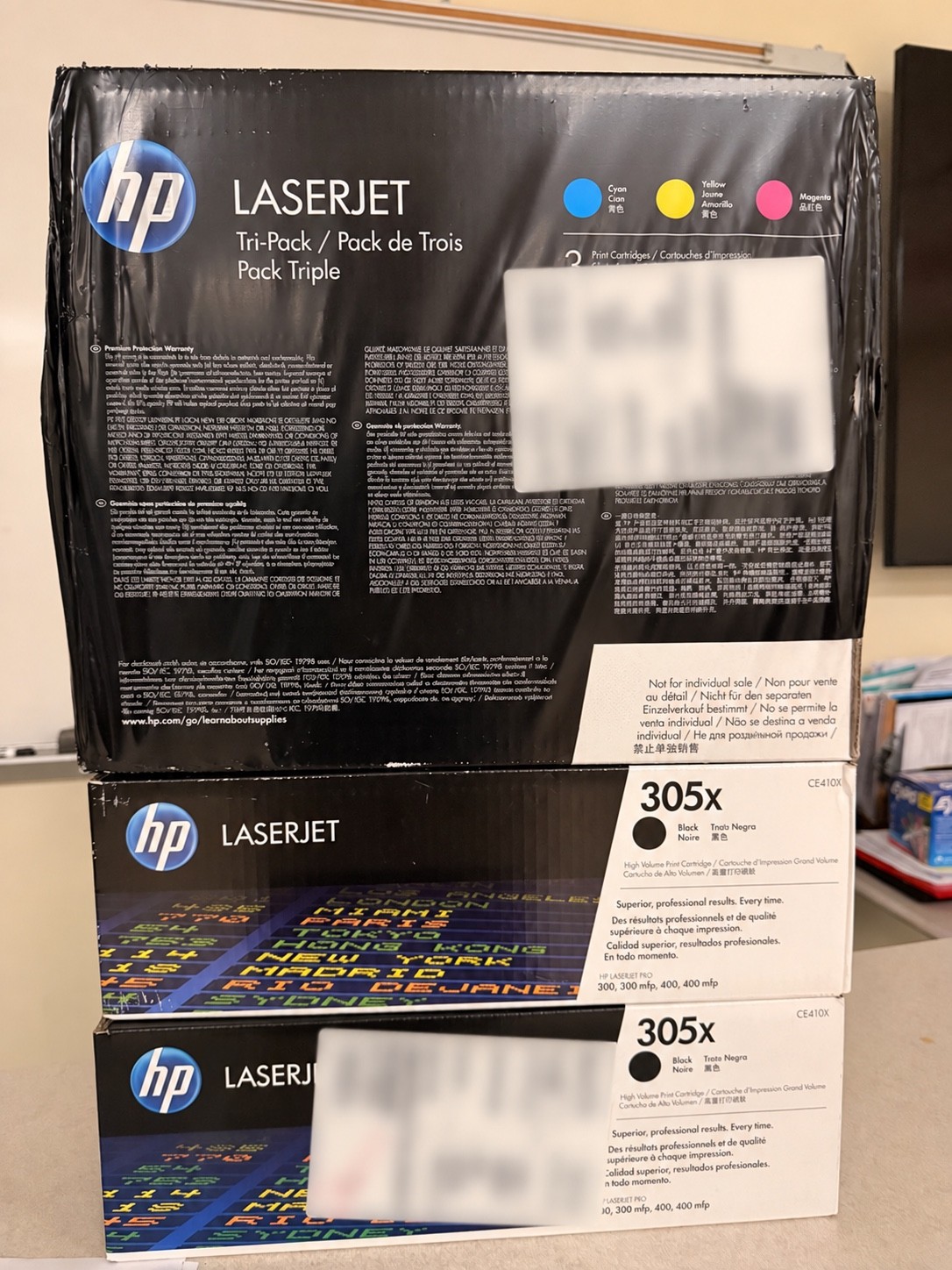 Genuine HP LaserJet toner lot, five cartridges in three packages.