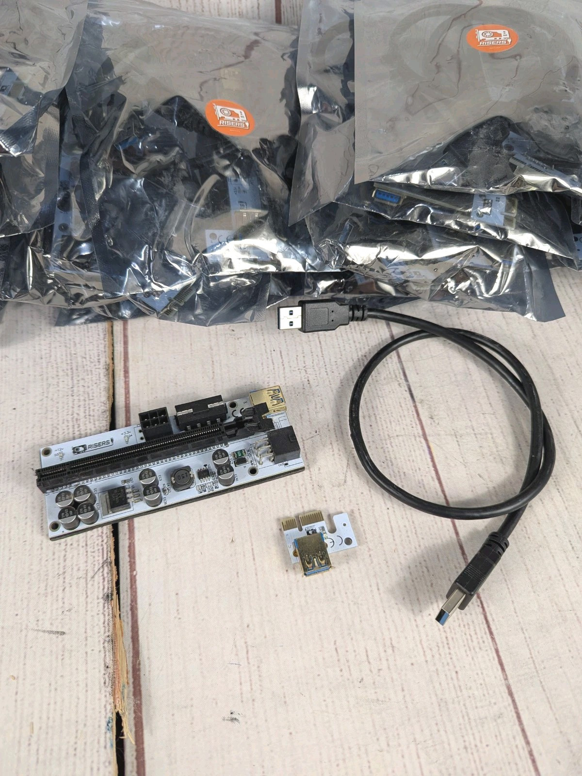 *Lot Of 24* GPU Risers - 8 Capacitor GPUrisers.com Brand W/ Cables - NEW UNUSED