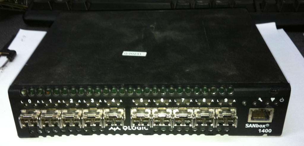Qlogic SANbox 1400 series Model: 1404 w/10x Finisar 4GBps SFP FTLF8524P2BNL