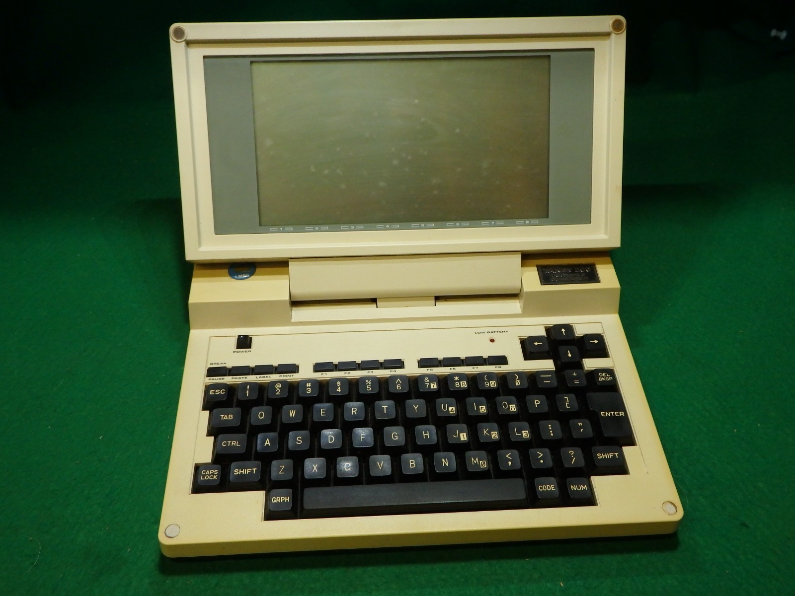 Vintage Tandy 200 Portable Computer with plastic travel sleeve, no power supply