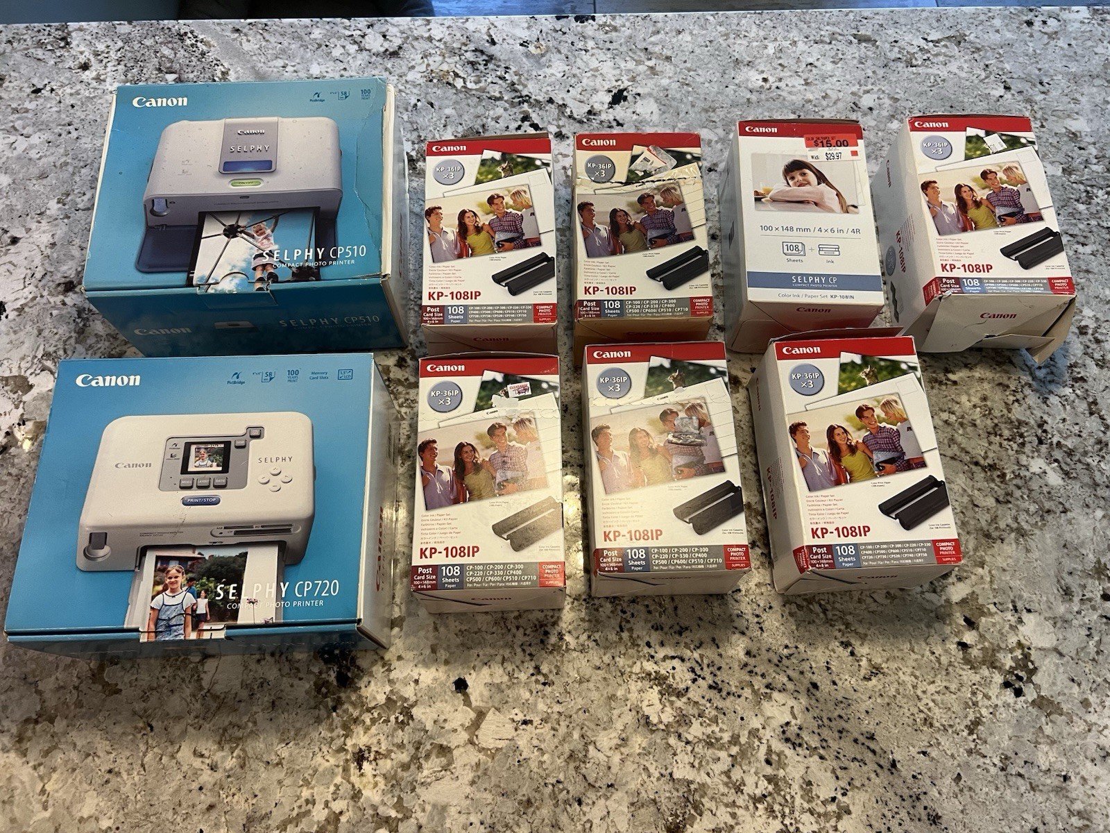 2 Canon SELPHY compact photo printers and Canon KP-108IP ink and paper sets