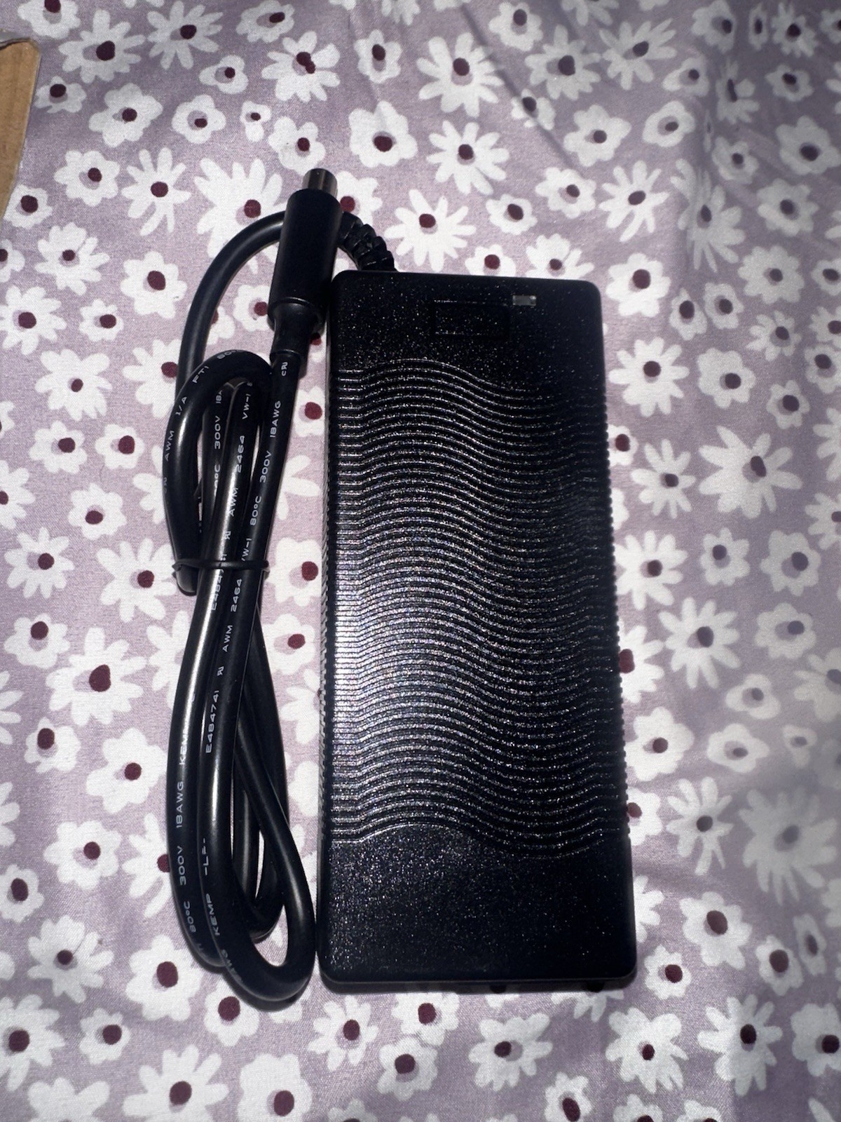 AC/DC adapter, specifically identified by the model number XVE-4200200