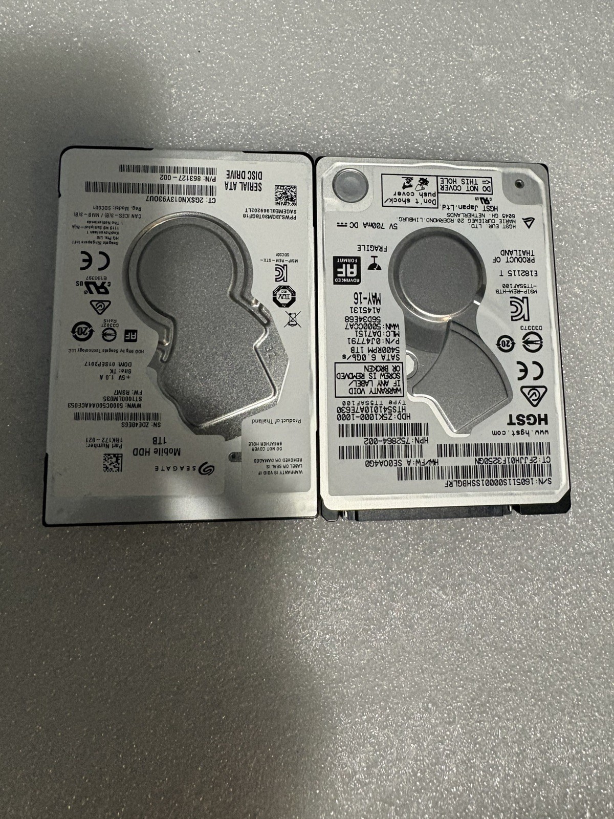 Lot of 2 Seagate and HGST 1 TB 5400 RPM 2.5" HDD 100% Health