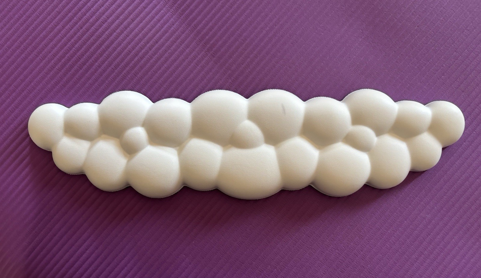 white, cloud-shaped keyboard wrist rest