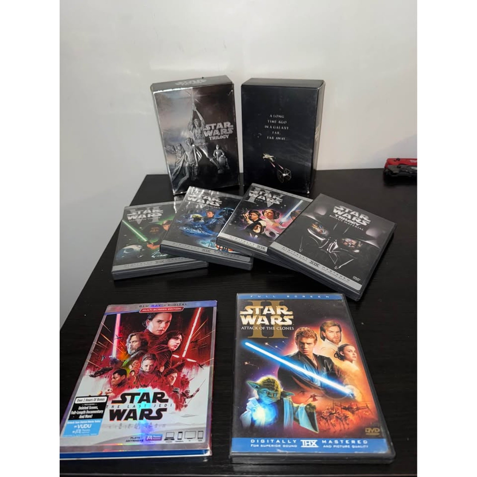 Star Wars Trilogy DVD Box Set, Episode II DVD, and The Last Jedi Blu-ray