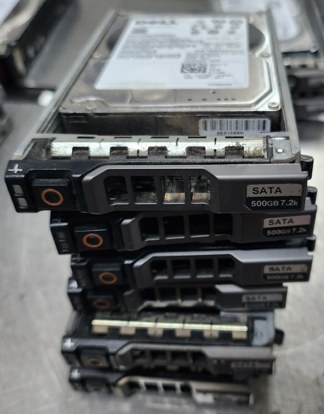 7x Dell J770N 500GB 7.2K RPM SATA 2.5" 3Gb/s Hard Disk Drives w/R series Trays