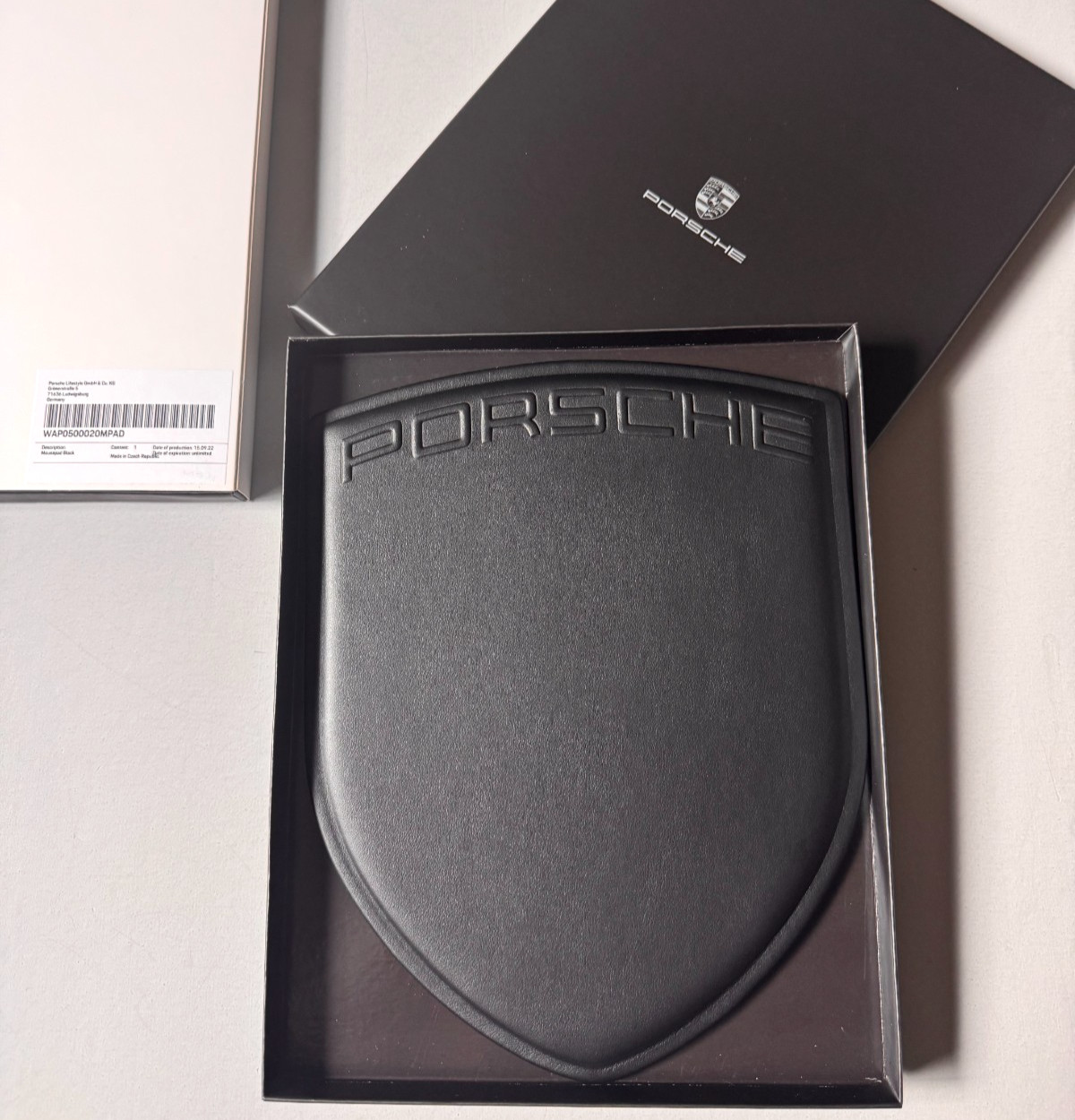 PORSCHE DESIGN EMBOSSED LEATHER COMPUTER MOUSE PAD IN THE SHAPE OF PORSCHE CREST