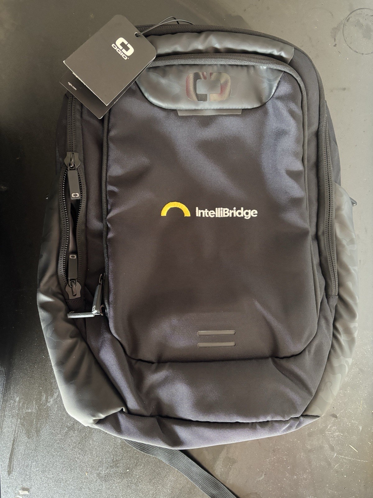 OGIO Laptop Backpack Intellibridge Logo NEW With Tags. Black Camo Side Pockets