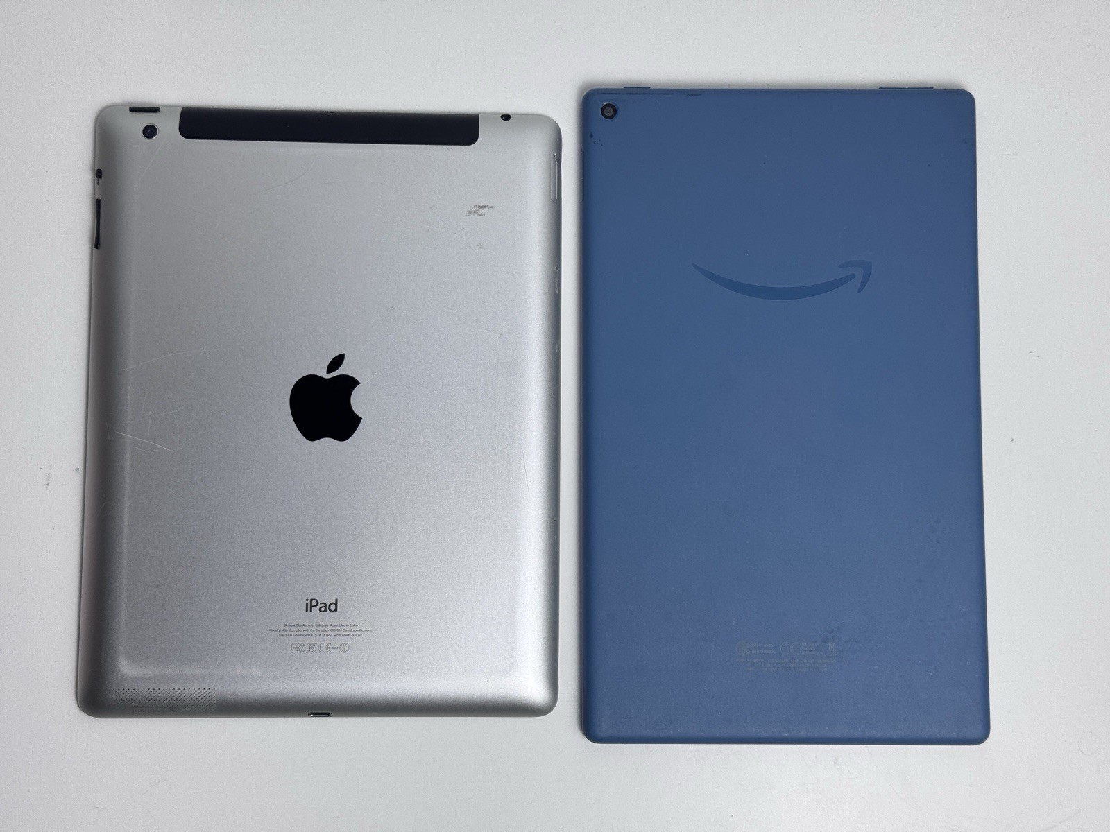 Used Tablet Lot Of 2 Apple And Amazon Fire, Good Condition For Parts Or Repair