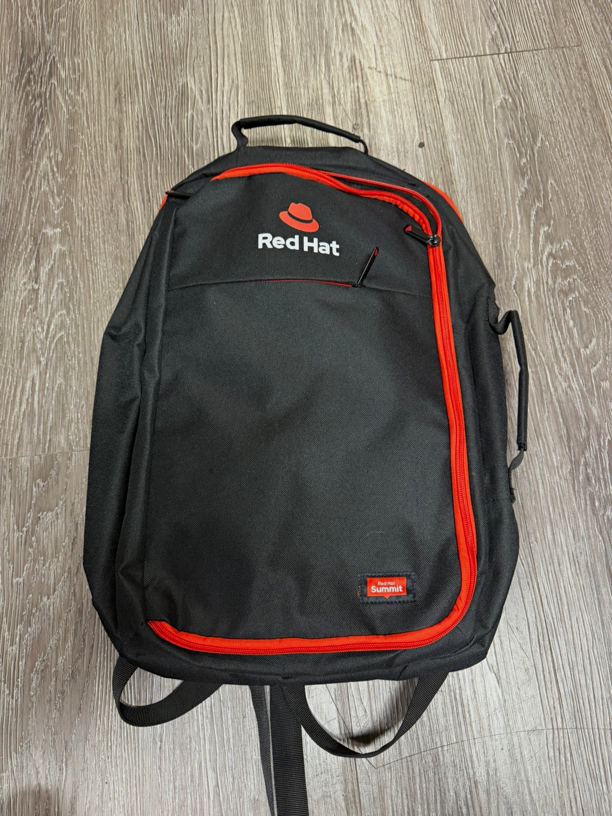 Red Hat Summit Padded Backpack All-Over Pattern in Black and Red Colors
