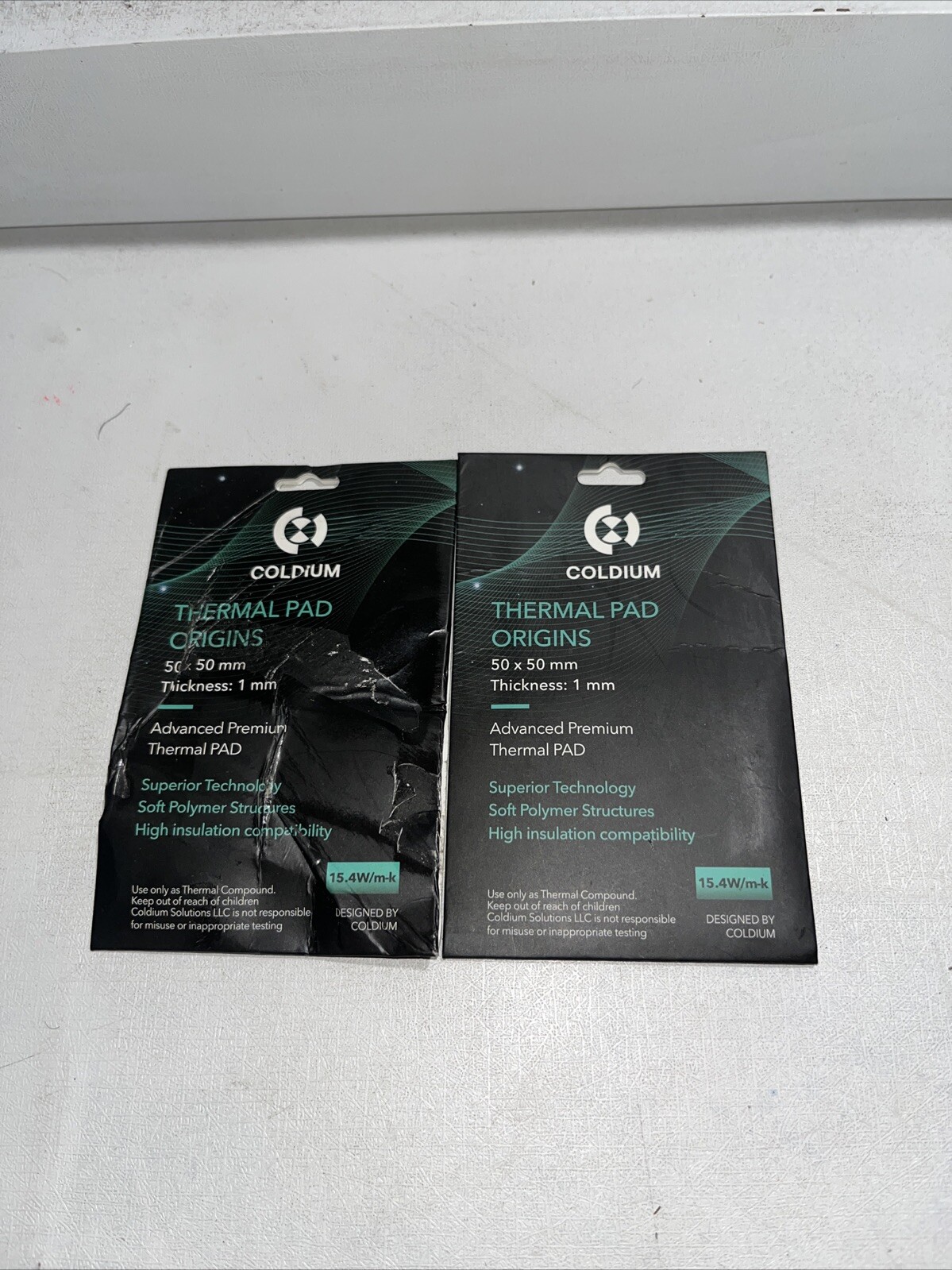 2-Coldium Thermal Pad 50x50mm Sealed, One Has Damaged Packaging