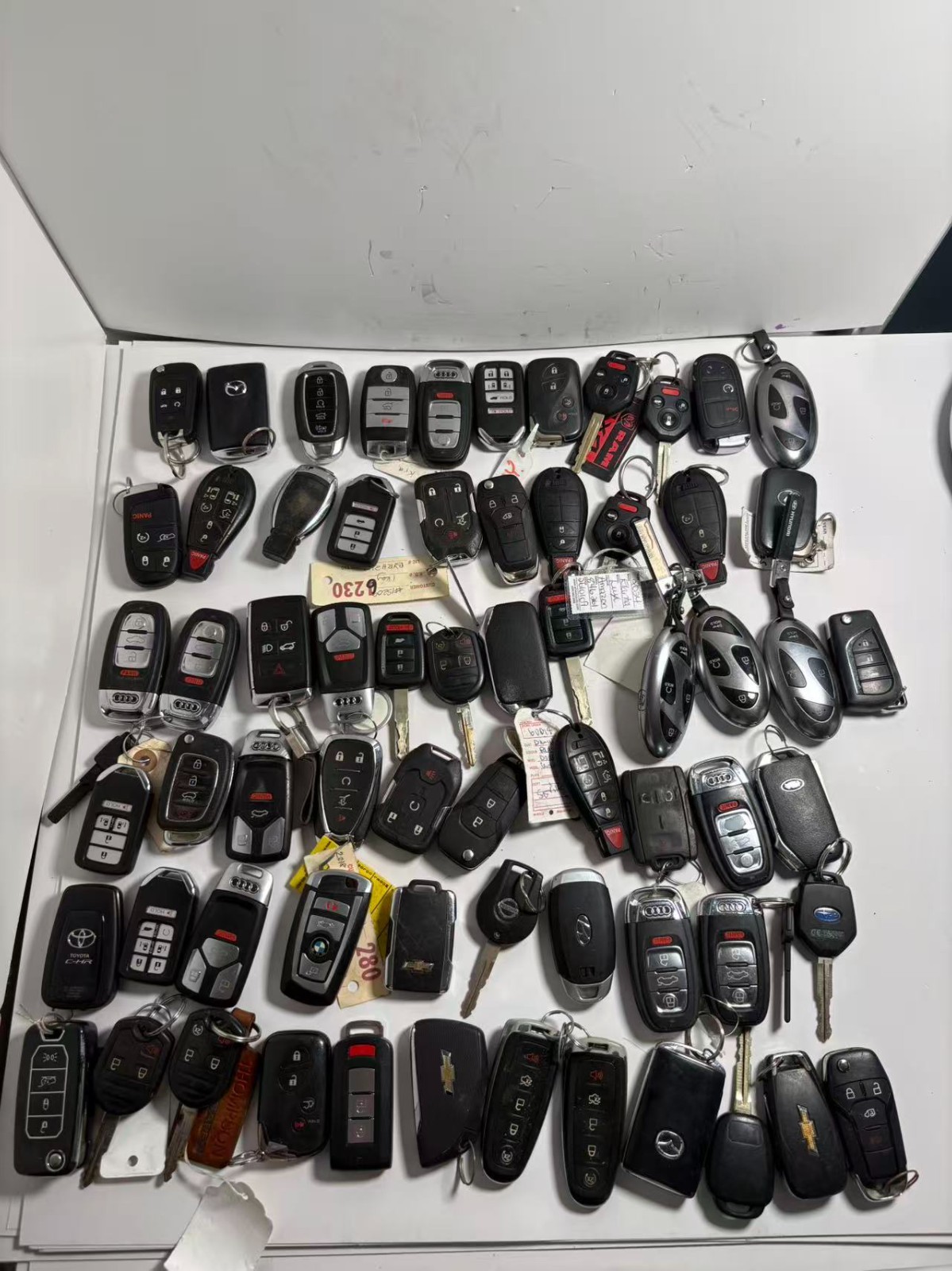 LOT OF 65 USED CAR KEY SHELLS/BLANKS – MIXED BRANDS, AS‑IS FOR PARTS