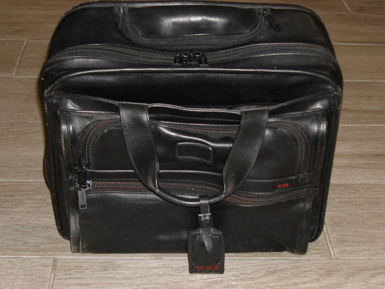 Preowned TUMI Black Leather Compact Wheeled Laptop Briefcase 96102DH $795