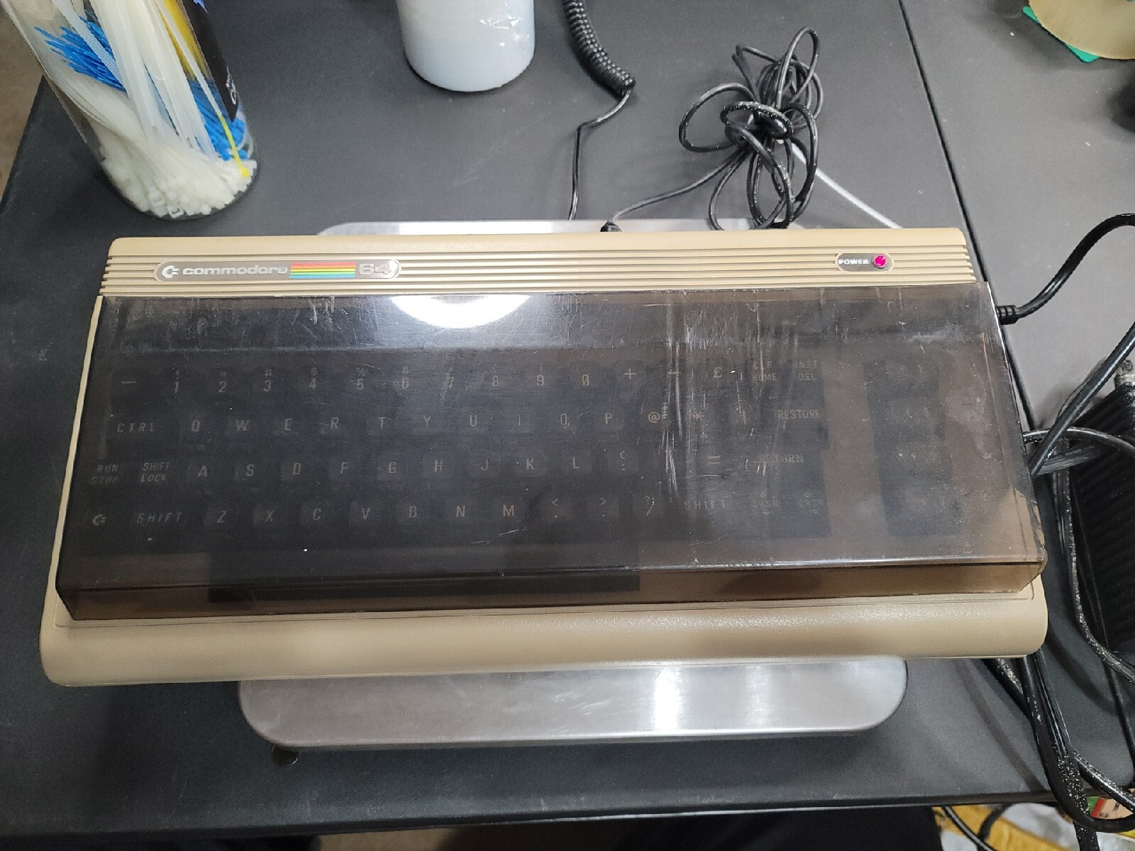 Vintage Commodore 64 Model No. 64 Powered On. Power adapter included.  