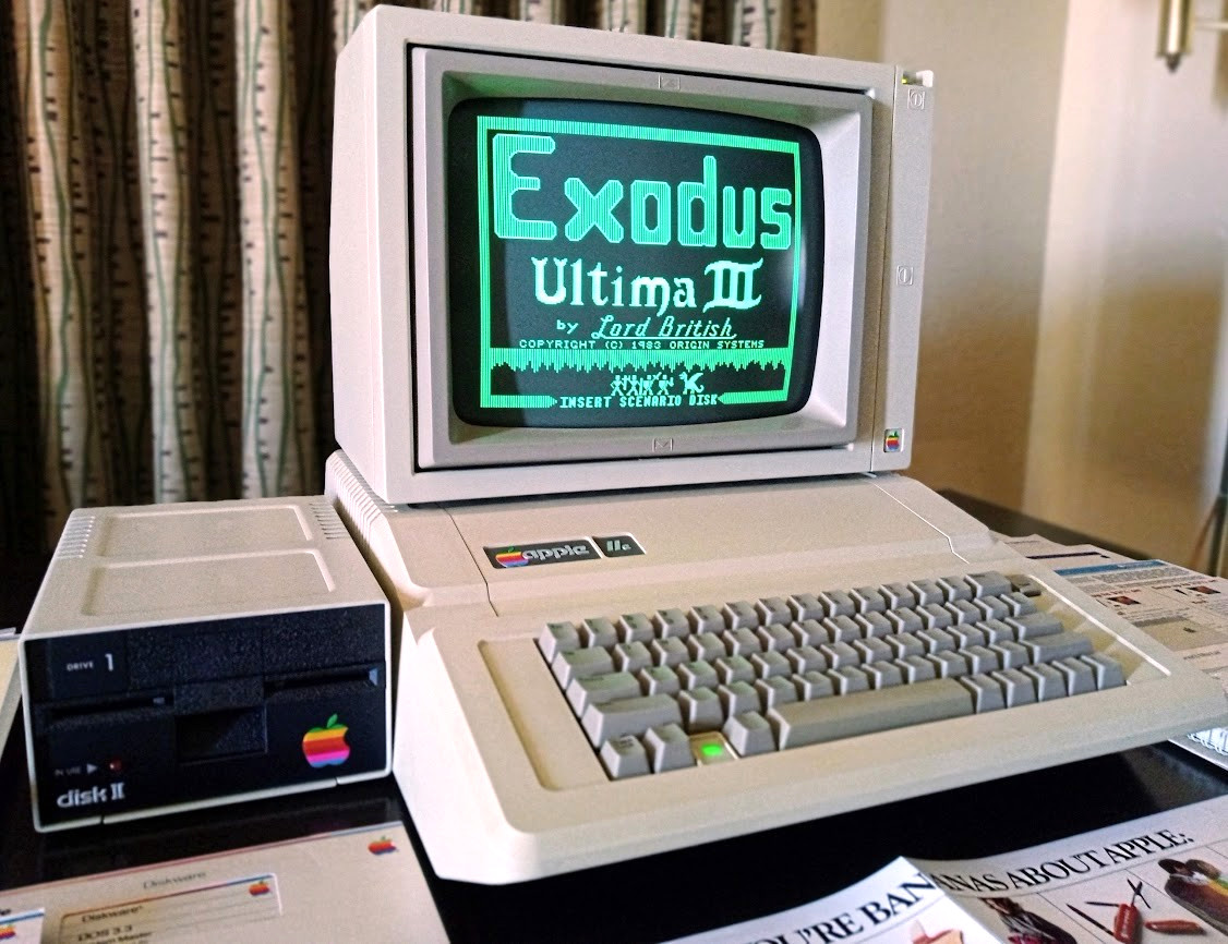 Apple IIe Computer, Floppy Drive, Monitor, Original Papers, Boxes and Software.