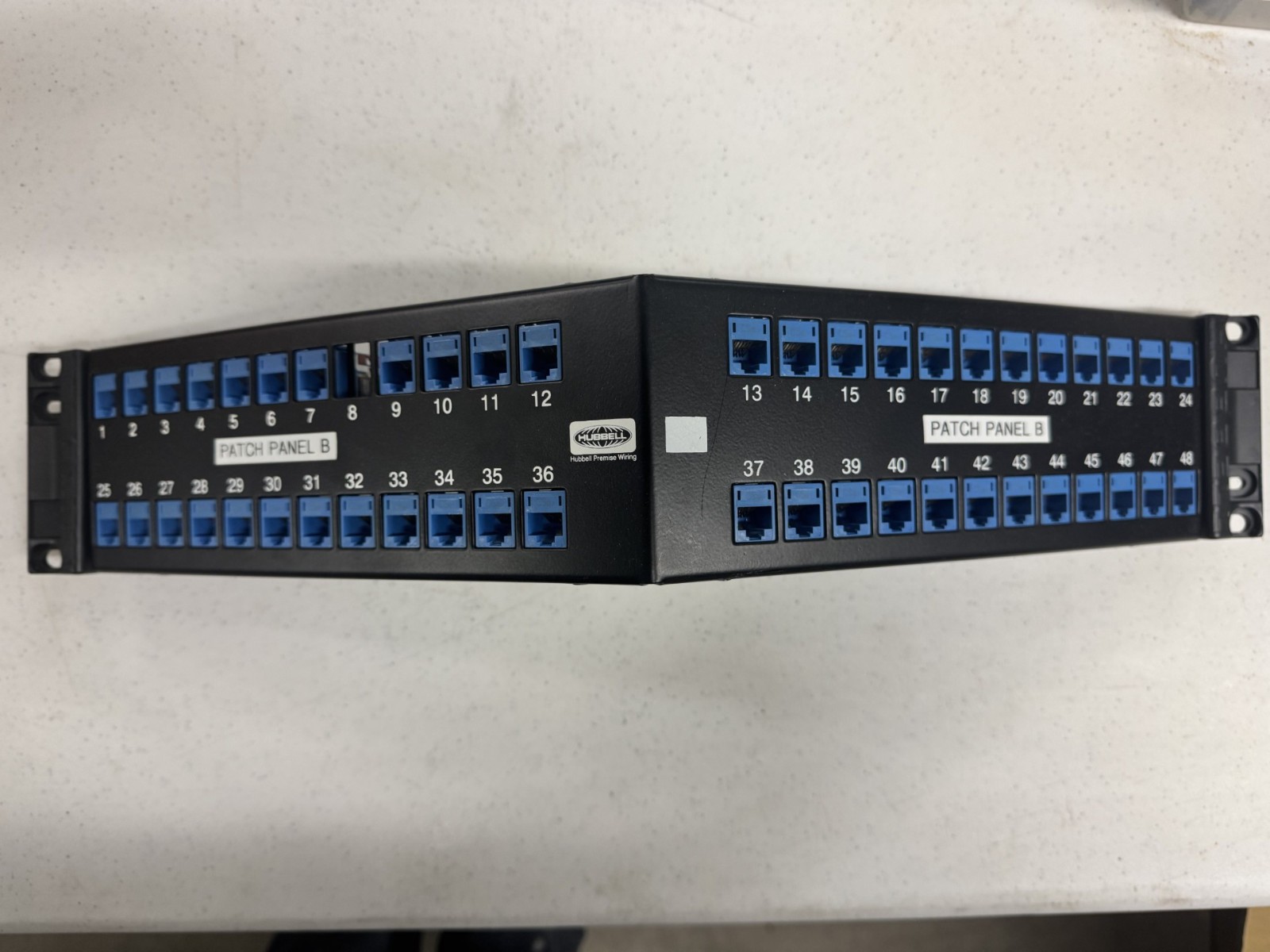 USED HUBBELL UDXA48 48 PORT ANGLED PATCH PANEL LOADED WITH CAT 5e JACKS 