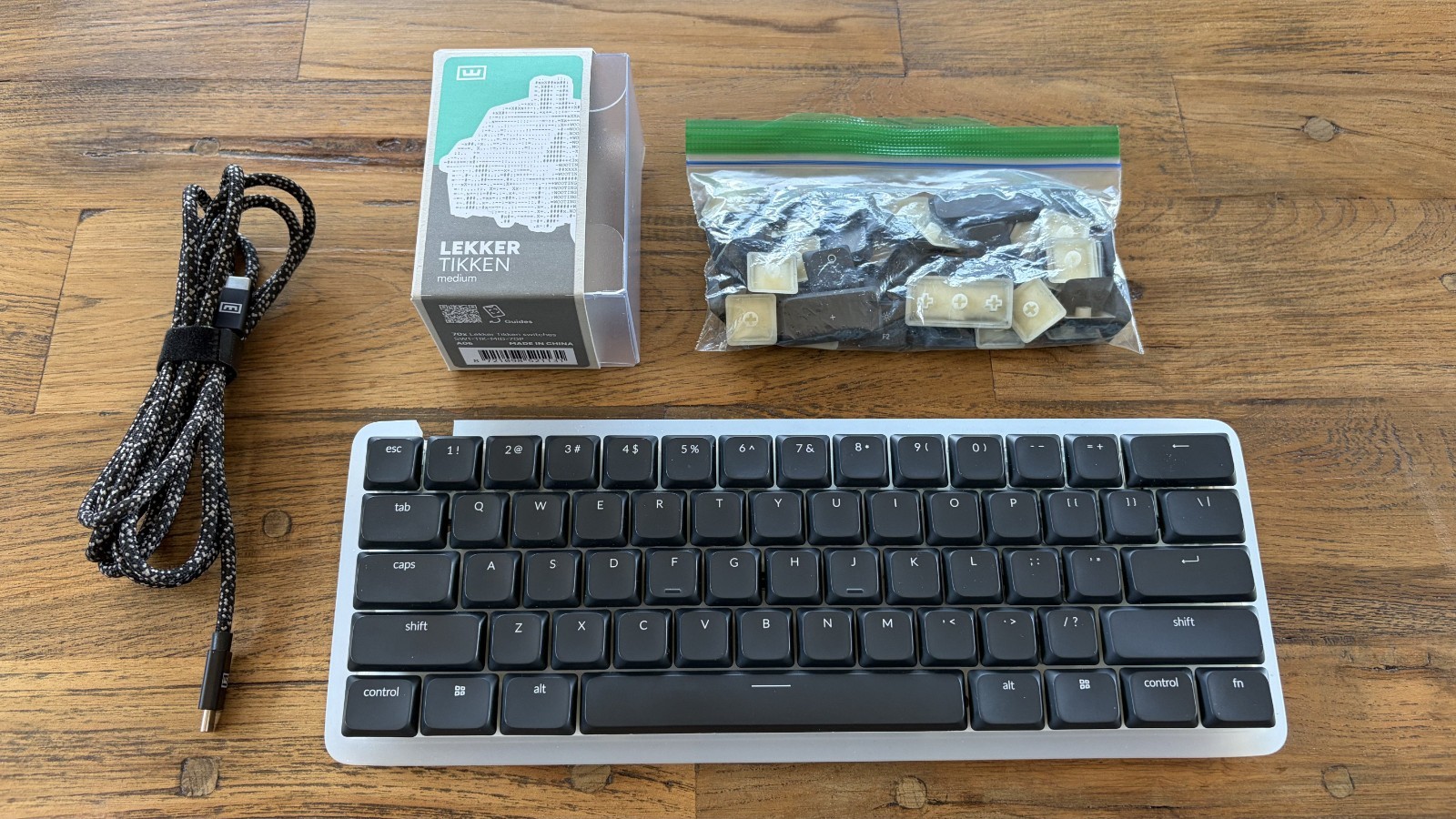 wooting 60he v2, with white Silicon case and Lekker Tikken Medium Switches