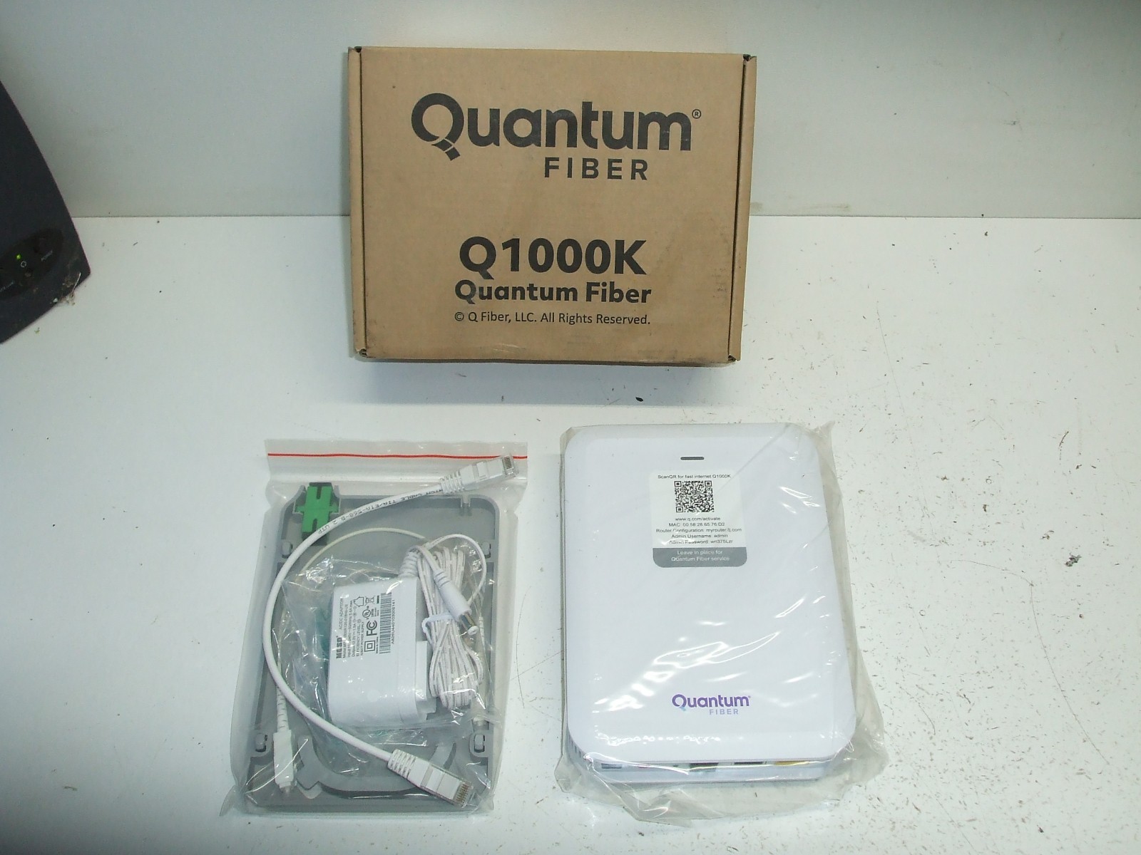 QUANTUM FIBER INTERNET Q1000K SMARTNID MODEM W/ WALL FIBER SPOOL BRACKET