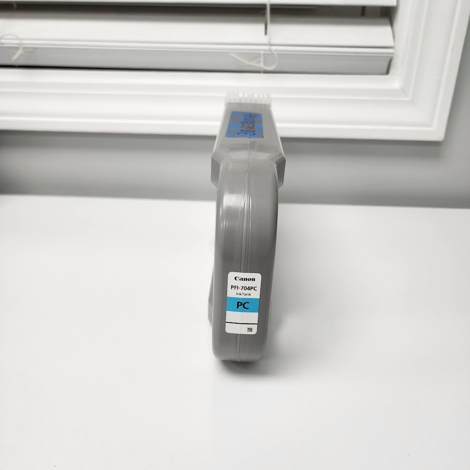 Canon PFI-704PC Ink Tank (Photo Cyan, 700ml Exp 2013