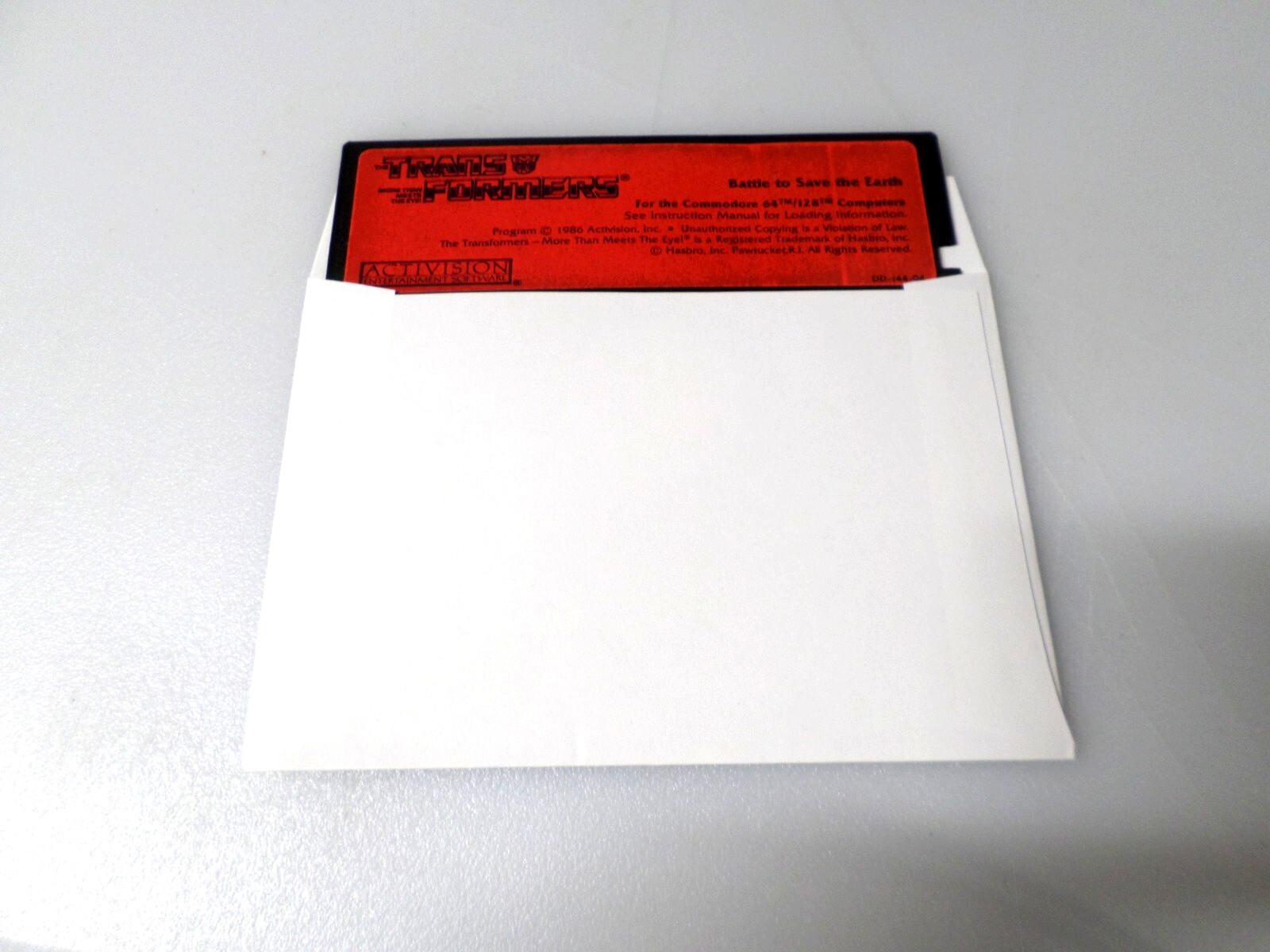 5.25" Floppy - COMMODORE 64/128 - TRANSFORMERS: BATTLE TO SAVE THE EARTH
