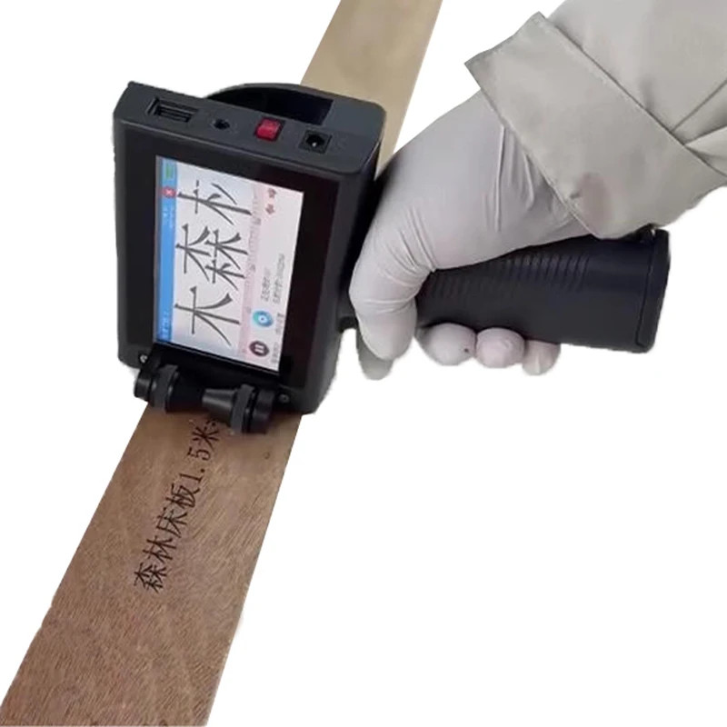 Portable Handheld Inkjet Printer Prints Date Code and Expiry Date on Snack Boxes