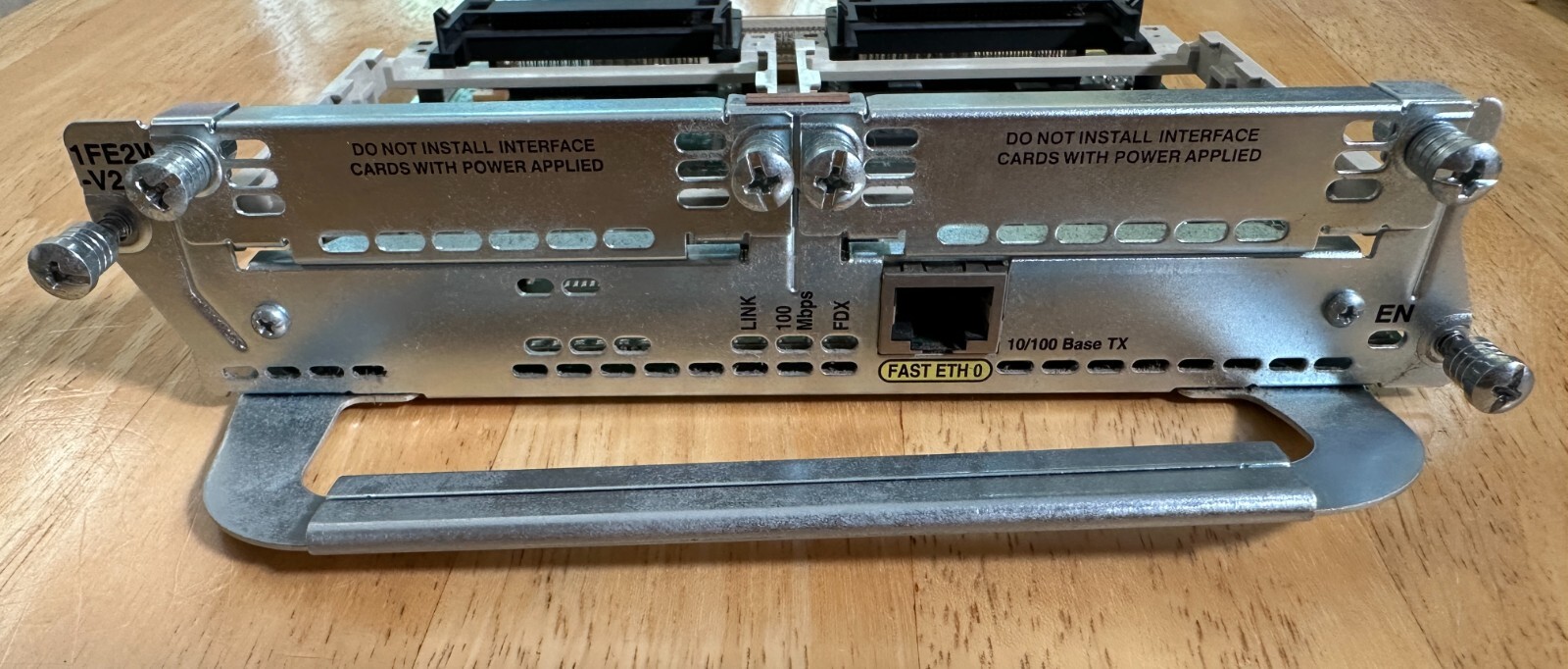 Cisco NM-1FE2W-V2 One Fast Ethernet Port Network Module with two WIC slots.