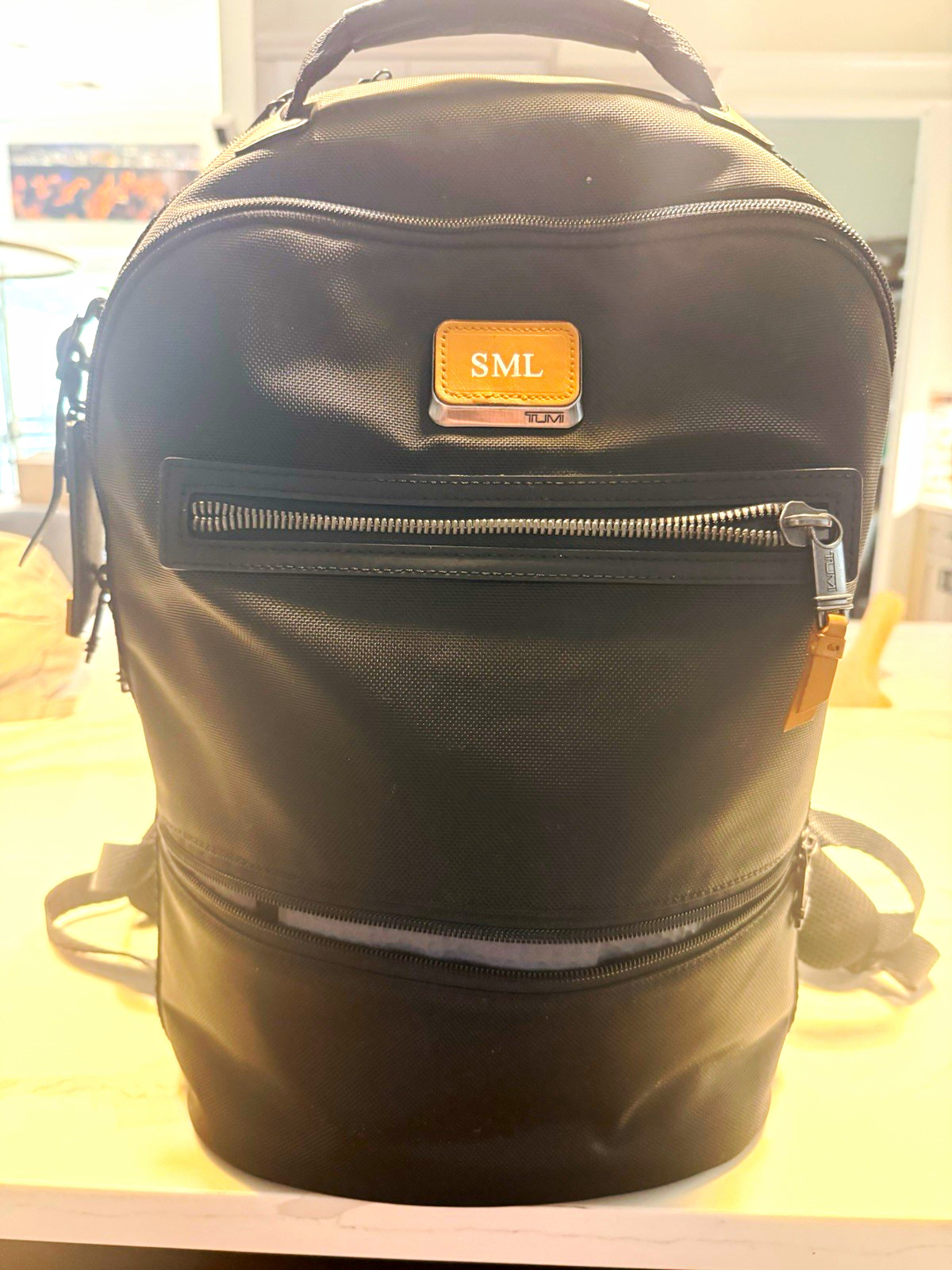 TUMI Black Alpha Bravo used with extra personalized badge