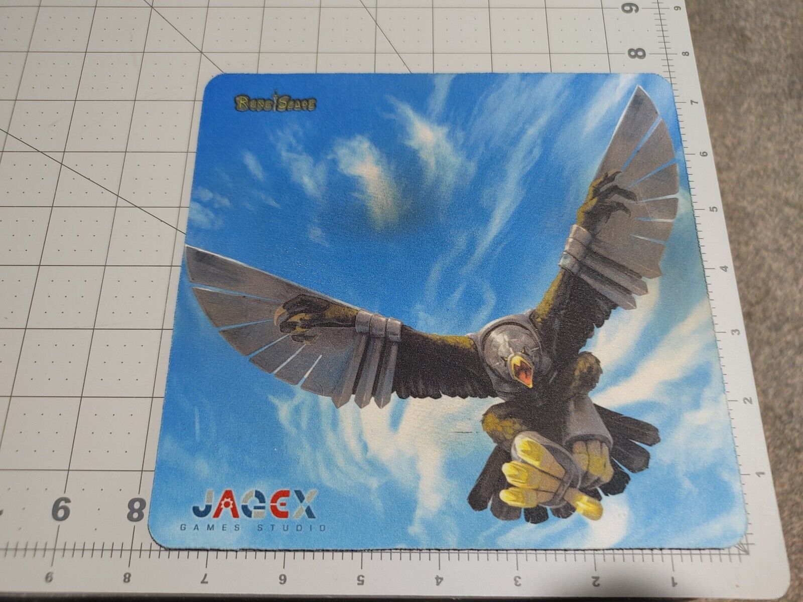 Official JAGEX Runescape Kree\'arra Mousepad, used with some wear and staining.