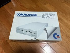 Commodore 1571 Disk Drive w/ Disk, Manual, Cables, Box, Head Vibration Protector picture