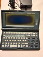 HP 200LX Palmtop PC 2MB RAM DOS Handheld + AC Adapter Case Manuals Catalog AS-IS picture