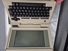 Vintage Tandy 200 Portable Computer with plastic travel sleeve, no power supply picture