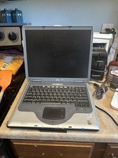 Vintage HP Compaq NX9010, powers on, screen has backlighting issues. picture