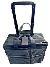 TUMI carry On 2 wheeled rolling briefcase Nylon black #26004D4. 17.5