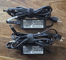 HP Compaq AC Adapters Quantity 2 Part Number 519329-001 Spare Number 463958-001 picture