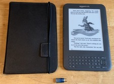 Kindle Keyboard, NEW battery, cover, 1 game, books, great condition. K3 bundle picture