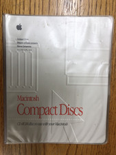 Macintosh Compact Discs Holder and random Discs / Macintosh Computer Software picture
