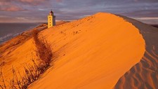 Landscape nature sand dunes lighthouse water sea clouds Custom Gaming Mat Desk picture